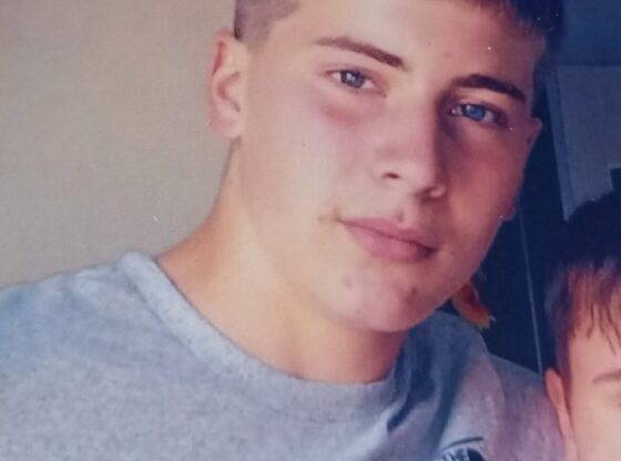 Jensen Westhead, a young man with short dark hair and blue eyes, wearing a gray t-shirt.