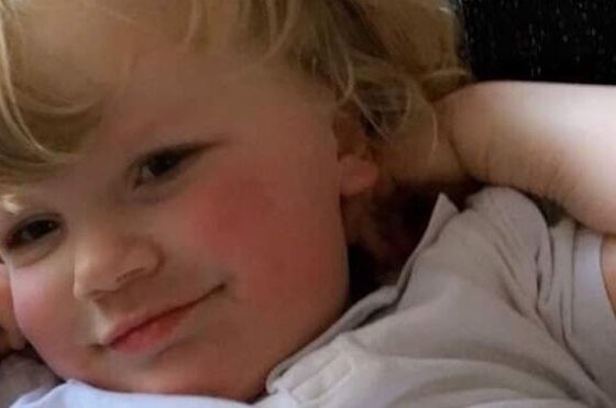 Theo Treharne-Jones, a five-year-old boy, with blonde hair and rosy cheeks.