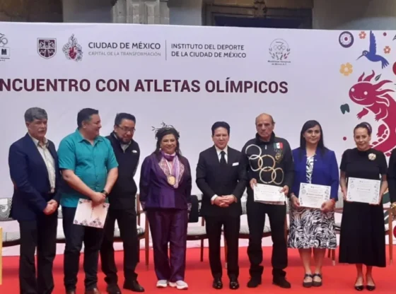 Former athletes receive diplomas as ambassadors of peace and sports, celebrating the 57th anniversary of Mexico 1968.