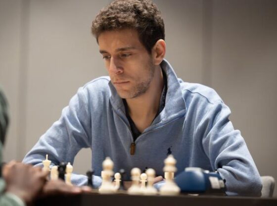 Daniel Naroditsky plays chess on the board, in this undated photo released by Charlotte Chess Center.