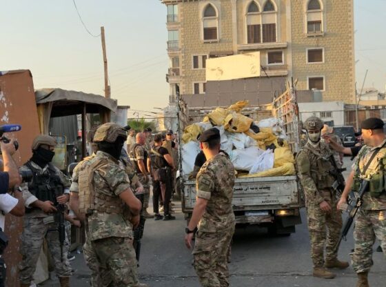 While transporting Palestinian weapons to a garage at the entrance to Burj al-Barajneh camp for inspection by the Lebanese army