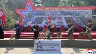 Kim Jong-un, in the center, and the Russian ambassador to North Korea, at the groundbreaking ceremony for the construction of the memorial.