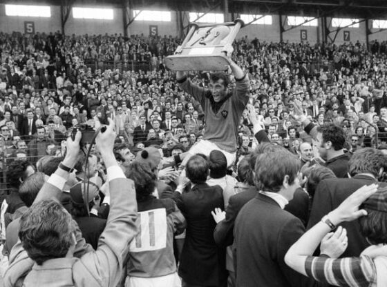 RC Toulon rugby player André Herrero holds the trophy and celebrates with supporters their victory over SU Agen at the Challenge Yves du Manoir, on May 24, 1970 in Colombes.
