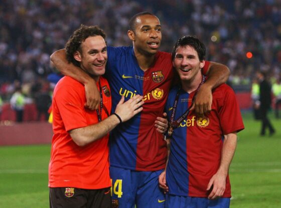 Milito alongside Henry and Messi after winning the Champions League in 2009.