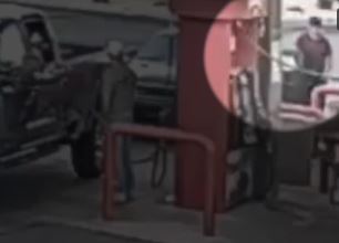 Tyler Robinson calmly fills up his car at a gas station.
