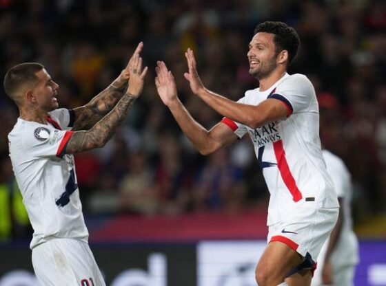 PSG's Gonçalo Ramos celebrates after scoring his side's second goal with PSG's Lucas Hernandez during the Champions League match between Barcelona and Paris Saint-Germain at the Lluis Companys Olympic Stadium in Barcelona, Spain, on October 1, 2025.