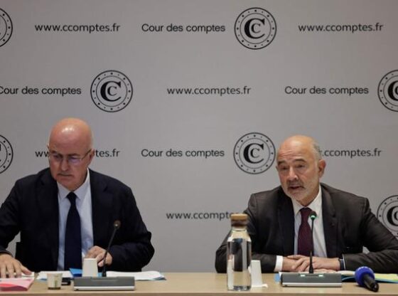 French Court of Accounts (Cour des comptes) first President Pierre Moscovici (R), alongside Nacer Meddah, president of the third chamber of the Court of Accounts, speaks during the Court of Accounts' report presentation of the Paris 2024 Olympic Games, in Paris on September 29, 2025.