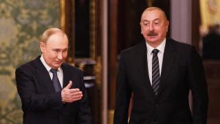 Russian President Vladimir Putin and Azerbaijani President Ilham Aliyev enter a room during a meeting on the sidelines of a summit of leaders of member nations of the Commonwealth of Independent States (CIS) at the Kremlin in Moscow, Russia, Oct. 8, 2024.