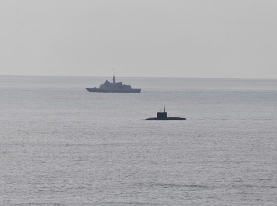 French Navy frigate supervising the Russian Novorossiysk diesel-electric attack submarine off the coast of Brittany.