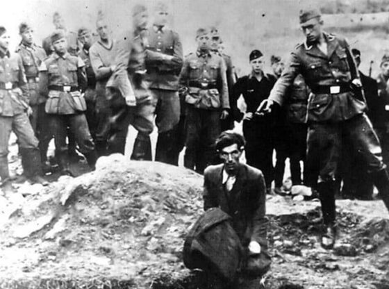 A Jewish prisoner about to be executed by a member of Einsatzgruppe D, near the Ukrainian village of Vinnitsa, 1941.