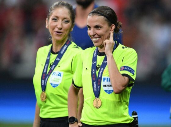French referee Stephanie Frappart (R) smiles next to assistant referee Manuela Nicolosi after the 2019 UEFA Super Cup football match between FC Liverpool and Chelsea at the Besiktas Park stadium in Istanbul.