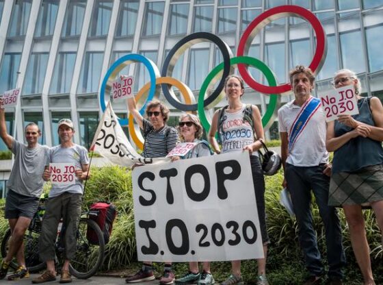 Members of the JOP 2030 citizens' collective, protesting to demand the withdrawal of France's bid for the 2030 Winter Olympics, in front of the International Olympic Committee headquarters, in Lausanne, Switzerland, on July 19, 2024.